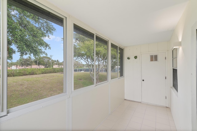 361 Normandy H, Delray Beach, FL 33484 - unfurnished sunroom featuring tile patterned floors