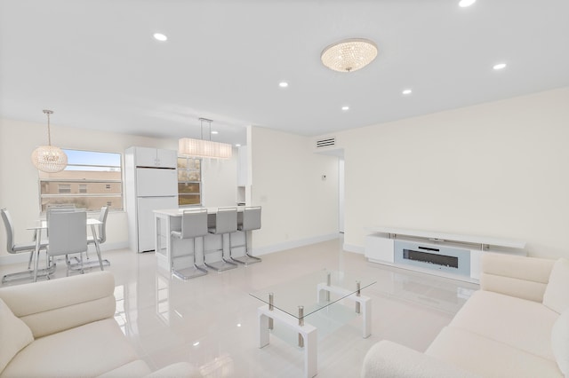 361 Normandy H, Delray Beach, FL 33484 - living area with recessed lighting and light tile patterned floors