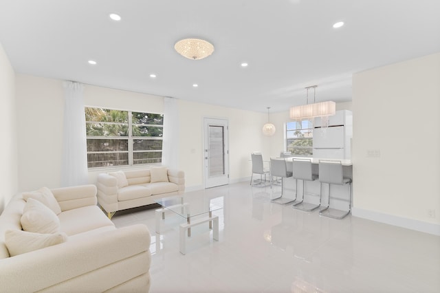 361 Normandy H, Delray Beach, FL 33484 - living room with recessed lighting, healthy amount of natural light, baseboards, and light tile patterned floors
