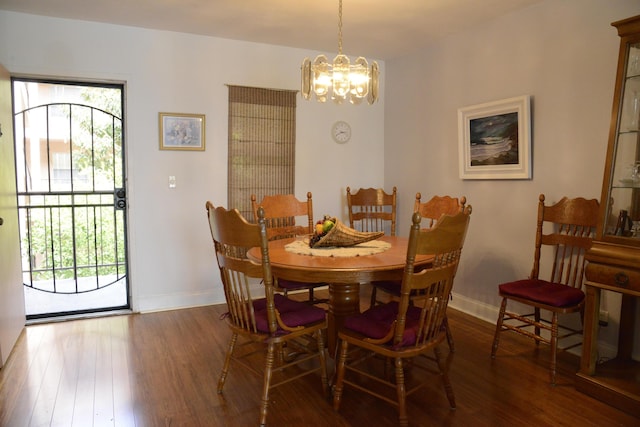 2841 Somerset Dr Unit 217, Lauderdale Lakes, FL 33311 - dining space with a chandelier, healthy amount of natural light, wood finished floors, and baseboards