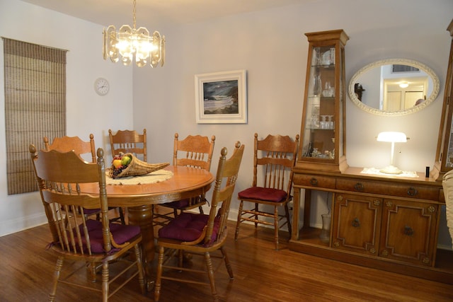 2841 Somerset Dr Unit 217, Lauderdale Lakes, FL 33311 - dining space featuring wood finished floors, a chandelier, and baseboards