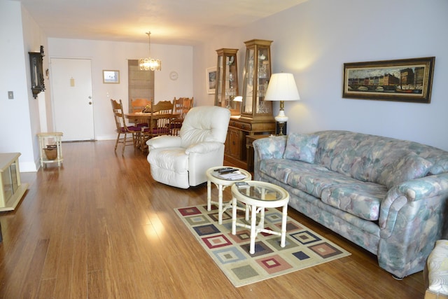 2841 Somerset Dr Unit 217, Lauderdale Lakes, FL 33311 - living area with a chandelier and wood finished floors
