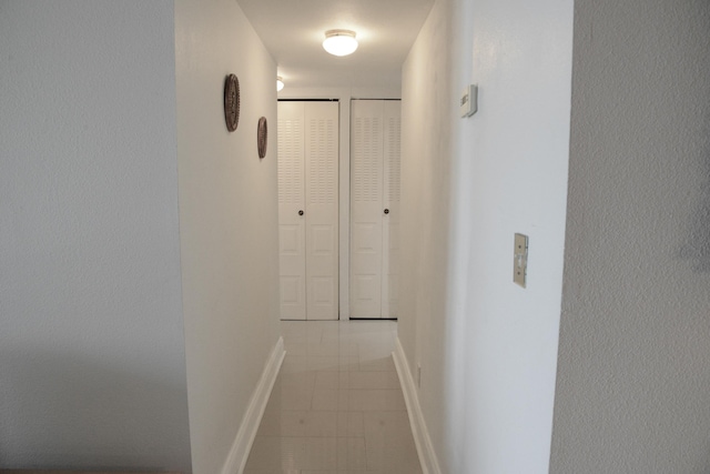 2841 Somerset Dr Unit 217, Lauderdale Lakes, FL 33311 - corridor with baseboards and light tile patterned floors