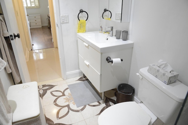 2841 Somerset Dr Unit 217, Lauderdale Lakes, FL 33311 - bathroom featuring toilet, vanity, and tile patterned floors