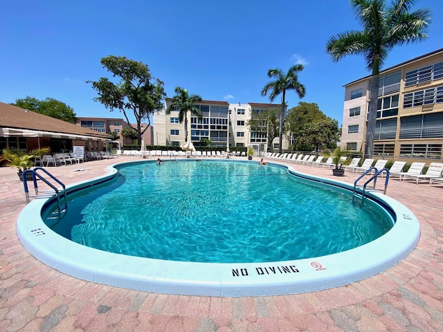 2841 Somerset Dr Unit 217, Lauderdale Lakes, FL 33311 - community pool with a patio
