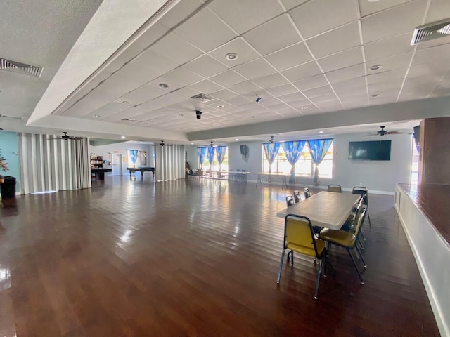 2841 Somerset Dr Unit 217, Lauderdale Lakes, FL 33311 - dining room with wood finished floors, baseboards, and a drop ceiling