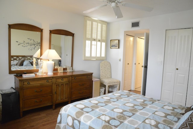 2841 Somerset Dr Unit 217, Lauderdale Lakes, FL 33311 - bedroom featuring dark wood-style flooring, a ceiling fan, and multiple closets