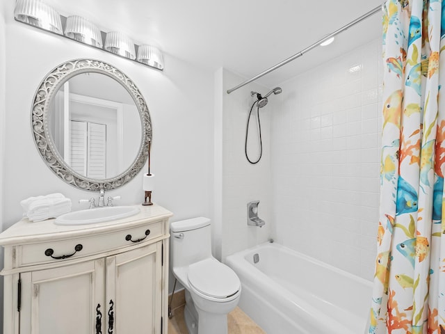 bathroom featuring shower / tub combo, toilet, and vanity