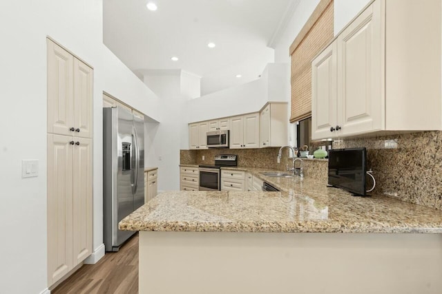 2437 NW 64th St, Boca Raton, FL 33496 - kitchen featuring decorative backsplash, light stone countertops, a sink, and stainless steel appliances