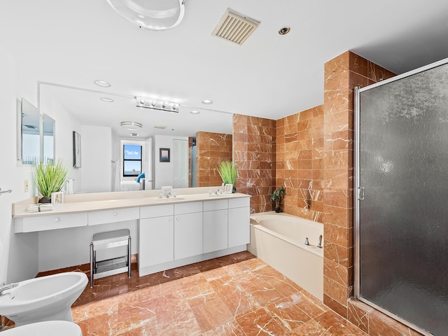 3450 S Ocean Blvd Unit 906, Highland Beach, FL 33487 - bathroom with a garden tub, vanity, a stall shower, a bidet, and recessed lighting