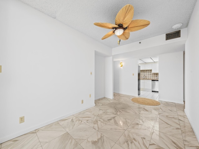 3450 S Ocean Blvd Unit 906, Highland Beach, FL 33487 - unfurnished living room featuring ceiling fan and a textured ceiling