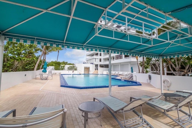 3450 S Ocean Blvd Unit 906, Highland Beach, FL 33487 - community pool with a patio