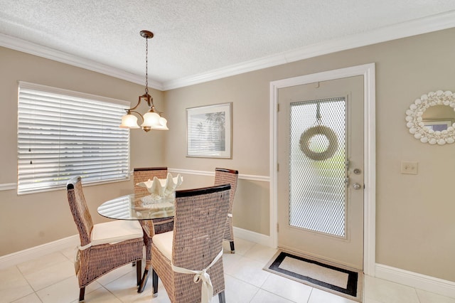 dining area with baseboards, a textured ceiling, light tile patterned floors, and crown molding