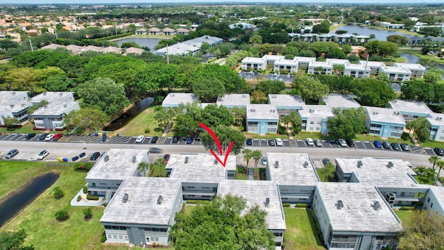 birds eye view of property featuring a water view