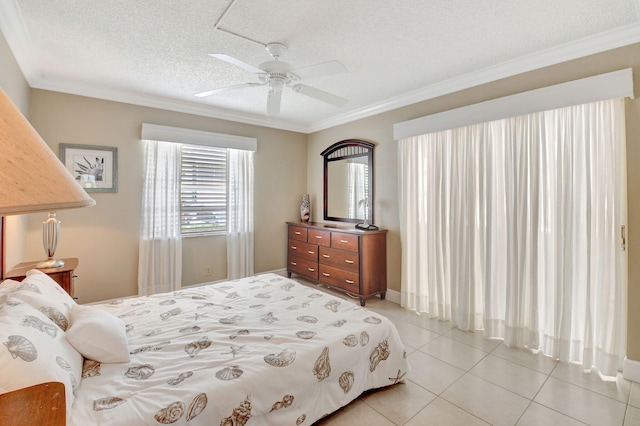 bedroom with light tile patterned flooring, a textured ceiling, crown molding, and ceiling fan