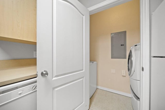 laundry area featuring baseboards and electric panel