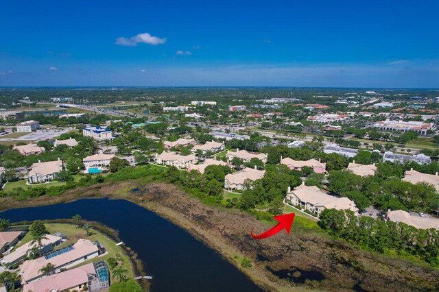 bird's eye view with a water view and a residential view