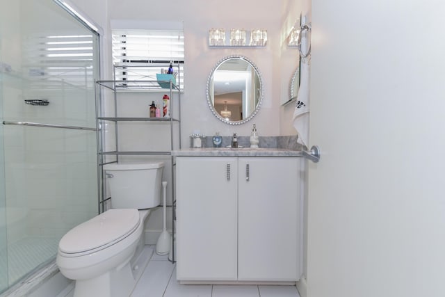 full bathroom with tile patterned floors, vanity, toilet, and tiled shower