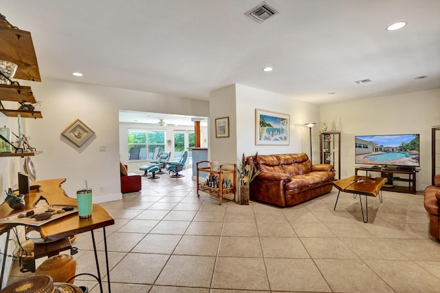 living room with recessed lighting, visible vents, a ceiling fan, and light tile patterned flooring