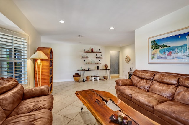 living room featuring recessed lighting, light tile patterned floors, visible vents, and baseboards