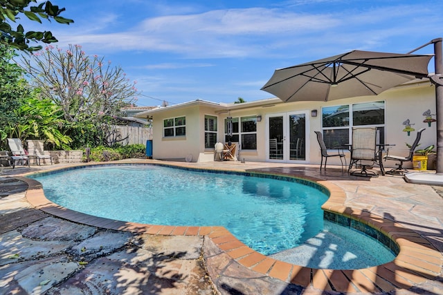 view of swimming pool with a fenced in pool, a patio, french doors, and fence