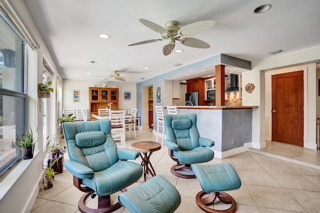 living room with visible vents, recessed lighting, and light tile patterned floors