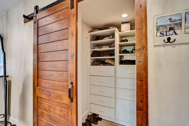 interior space featuring a barn door