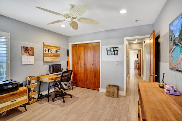 office space with recessed lighting, light wood-style flooring, a ceiling fan, and baseboards