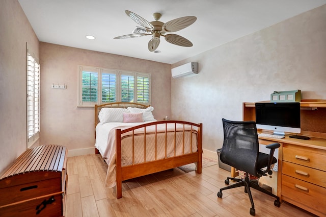 bedroom featuring light wood-style floors, a ceiling fan, recessed lighting, a wall mounted AC, and baseboards