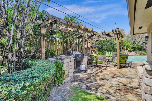 view of patio with grilling area, a pergola, a fenced in pool, and fence