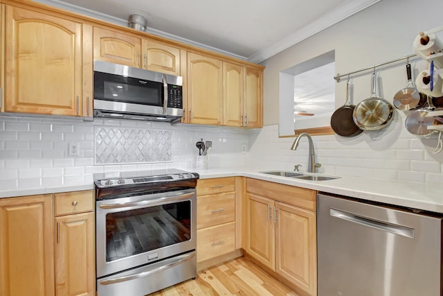630 Glenridge Dr, West Palm Beach, FL 33405 - kitchen with light countertops, a sink, stainless steel appliances, and light brown cabinetry