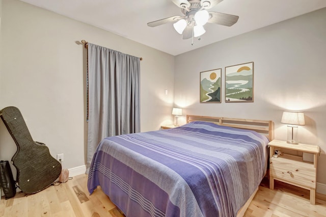 630 Glenridge Dr, West Palm Beach, FL 33405 - bedroom with baseboards, ceiling fan, and wood finished floors