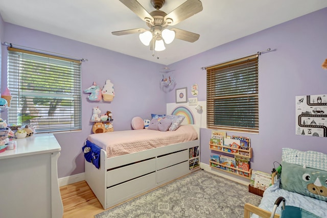 630 Glenridge Dr, West Palm Beach, FL 33405 - bedroom featuring a ceiling fan, baseboards, and light wood-type flooring