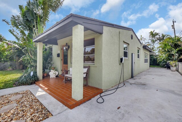 630 Glenridge Dr, West Palm Beach, FL 33405 - exterior space featuring stucco siding and a patio area