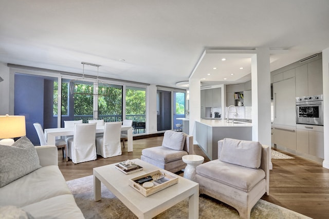 living room with wood finished floors and recessed lighting