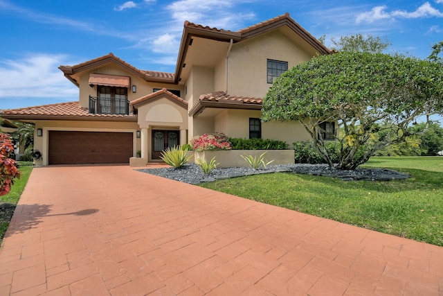761 SW 87th Ter, Plantation, FL 33324 - mediterranean / spanish home featuring a balcony, stucco siding, decorative driveway, a front lawn, and a tiled roof