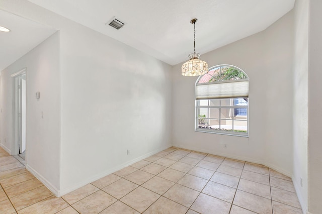 spare room with light tile patterned flooring, baseboards, visible vents, and a chandelier