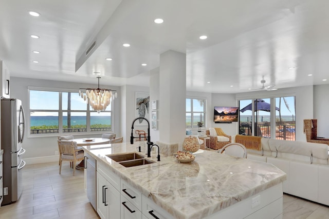 1149 Hillsboro Mile Unit 112N, Hillsboro Beach, FL 33062 - kitchen with open floor plan, a sink, stainless steel appliances, and visible vents