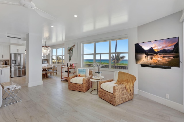 1149 Hillsboro Mile Unit 112N, Hillsboro Beach, FL 33062 - living area featuring baseboards, visible vents, a notable chandelier, and recessed lighting