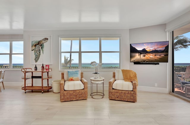 1149 Hillsboro Mile Unit 112N, Hillsboro Beach, FL 33062 - living area featuring baseboards