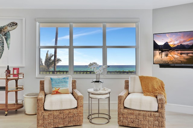 1149 Hillsboro Mile Unit 112N, Hillsboro Beach, FL 33062 - sitting room with baseboards and wood finished floors