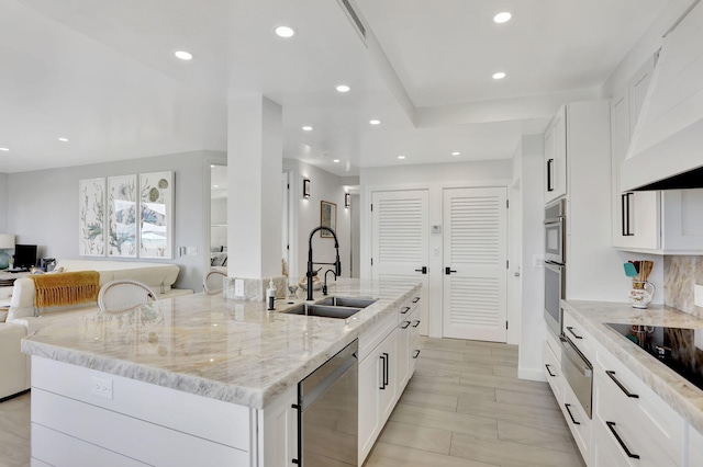 1149 Hillsboro Mile Unit 112N, Hillsboro Beach, FL 33062 - kitchen with light stone countertops, recessed lighting, a sink, open floor plan, and stainless steel dishwasher