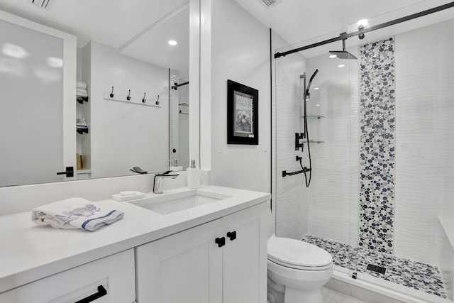 1149 Hillsboro Mile Unit 112N, Hillsboro Beach, FL 33062 - bathroom featuring a shower stall, visible vents, toilet, and vanity