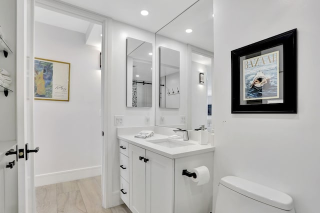 1149 Hillsboro Mile Unit 112N, Hillsboro Beach, FL 33062 - full bath featuring toilet, vanity, baseboards, and recessed lighting