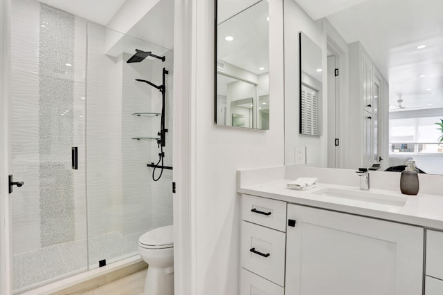 1149 Hillsboro Mile Unit 112N, Hillsboro Beach, FL 33062 - bathroom featuring toilet, a stall shower, recessed lighting, and vanity