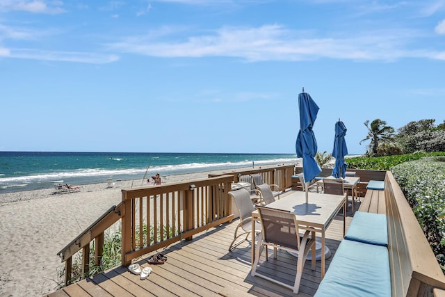 1149 Hillsboro Mile Unit 112N, Hillsboro Beach, FL 33062 - wooden deck with a water view, outdoor dining space, and a beach view
