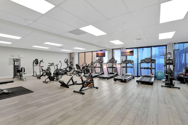 1149 Hillsboro Mile Unit 112N, Hillsboro Beach, FL 33062 - gym with visible vents, baseboards, expansive windows, and wood finished floors