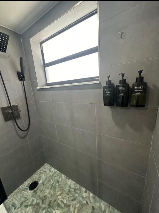 664 SE 20th Ave Unit 1, Deerfield Beach, FL 33441 - full bath featuring a tile shower