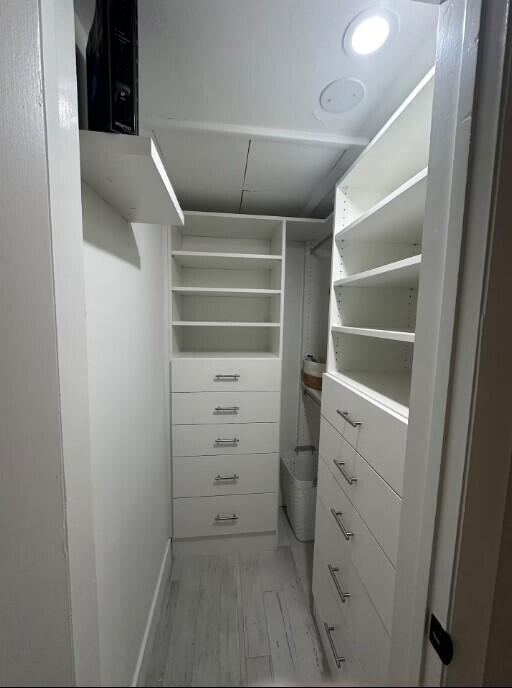 664 SE 20th Ave Unit 1, Deerfield Beach, FL 33441 - walk in closet with light wood-style flooring
