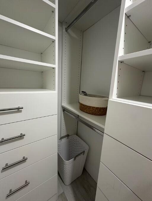 664 SE 20th Ave Unit 1, Deerfield Beach, FL 33441 - walk in closet featuring wood finished floors